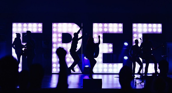 FREE sign in lights with people dancing