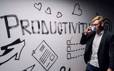 productivity on whiteboard with man talking on phone